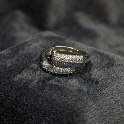 Modern Embrace: Silver Pave Crossover Ring with Black Stone Accent